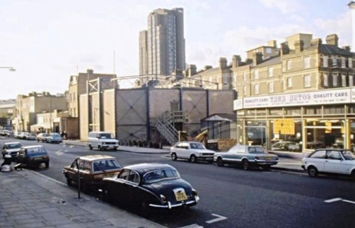 The Cut, c1978. Looking at The Young Vic theatre with Union Jack Club tower behind it, right is the Peabody Trust Flats in Cons Street. Pic 1.   X.png