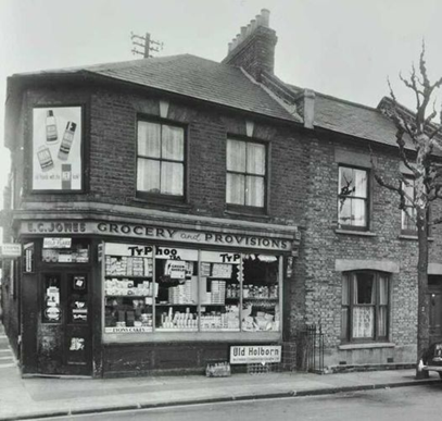 St Helena Road, Rotherhithe, 1964, E. C. Jones Grocery shop on the corner of Eugenia road left.   X.png
