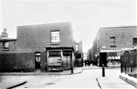 Kinglake Street,1937. You are looking towards the Old Kent Road; Eagle Place is to the left and Brook Cottages to the right. The Two Eagles pub is jutting out in the gap.  X.png