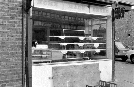 Bagshot Street, Dalwoods Bakers at no. 23 on the corner with Smyrk's Road in 1988.   X..png