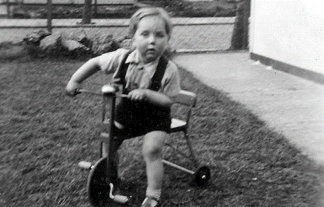 Catlin Street, Bermondsey c1950. Bill Cain as a baby outside their in Catlin Street prefab. X..png