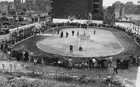 Larnaca Street,c1950, Bermondsey Greyhounds V Ruskin Flyers.  Abbey Buildings, Royal George Pub, top left.  X..png