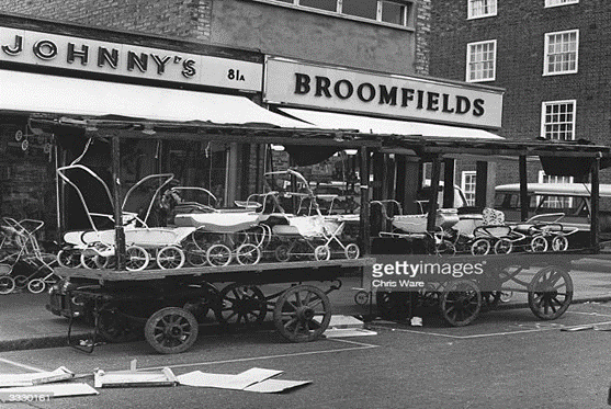 East Street Market, barrows stacked with prams and pushchairs for sale, c1962..png