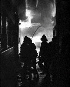Victory Place, SE17, Southwark, 27 April 1958. Firefighters in action with hosepipes during a fire at a warehouse. X. .jpg