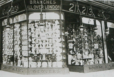 Old Kent Road corner with Marcia Road left, the shop of George Carter at 211-217 Old Kent Road, opposite East Street.  X..png