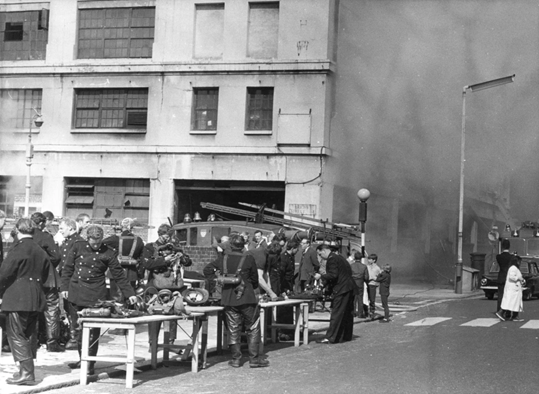 Stamford Street, Southwark, Firefighters, and onlookers outside Lyons Maid Ltd, 1968. X..png