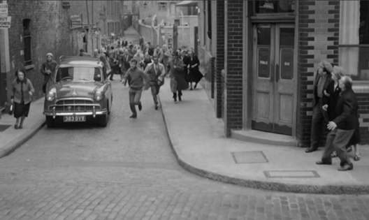 Clerk’s Orchard, Rotherhithe, Europa Tavern right, looking from St Mary Church Street. From the film The Giant Behemoth 1959.  X..png