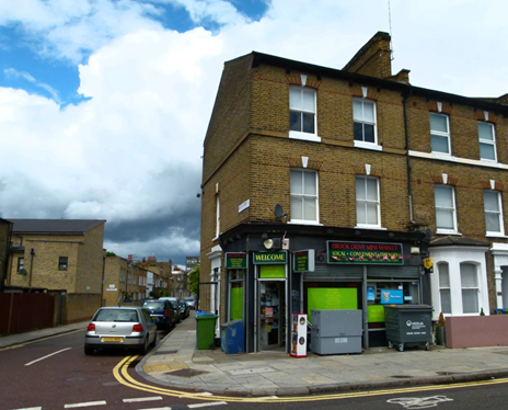 Hayles Street straight through, Brook Drive left to right. The shop now a newsagent was used to film the video to  Come on Eileen by Dexy’s Midnight Runners in 1982.  X..png