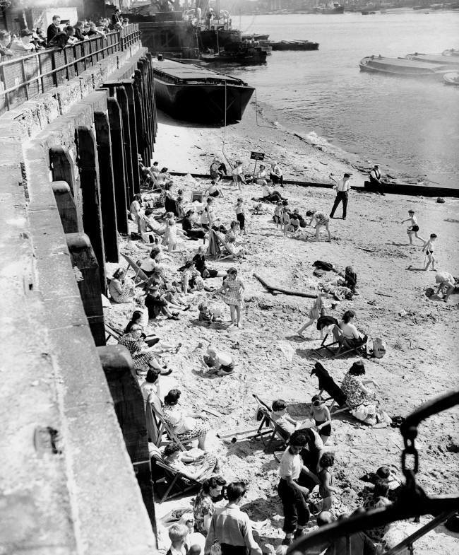 Tower Bridge Beach ,Children enjoy the summer in the centre of London, 1953.jpg