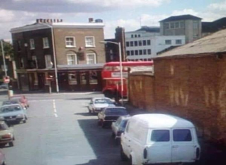 Trundleys Terrace, taken from the footbridge, looking at the Woodman Pub with Molins in the background, Bestwood Street left. Trundleys Road, where the bus is c1970.  X..png