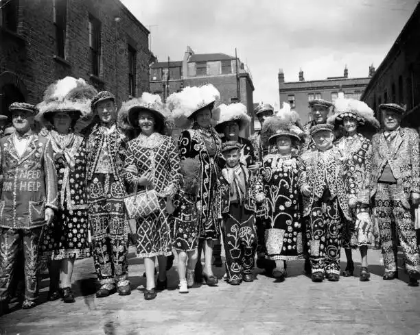 1.  Pearly Kings and Queens, Old Kent Road for the annual service at St Mary Magdalene's Church in Massinger Street, c1951.  X..png