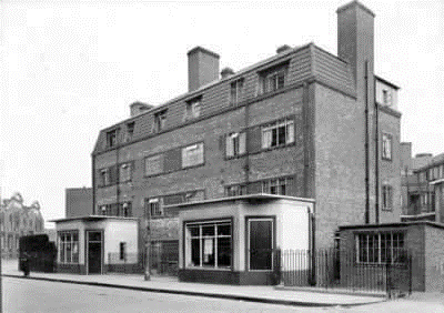 15.  Rotherhithe Street, opposite Bellamy’s Wharf, Amos Estate behind. Chippy shop left, Grocery shop right.  X..png