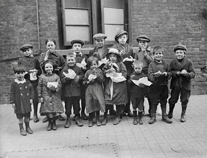 Children eating a penny's worth of Plum Duff (a rich, spiced suet pudding made with raisins or currants) from soup kitchens in Bermondsey, South London, c1917. My mum made this.  X..png