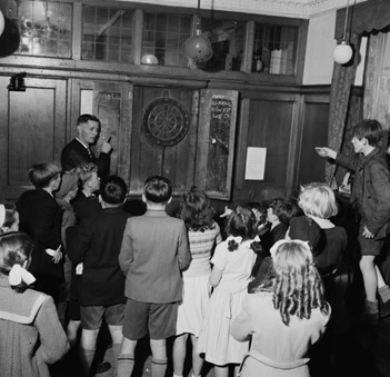 Jamaica Road, children playing darts at the Royal George pub in Rotherhithe, c1954.  X..jpg
