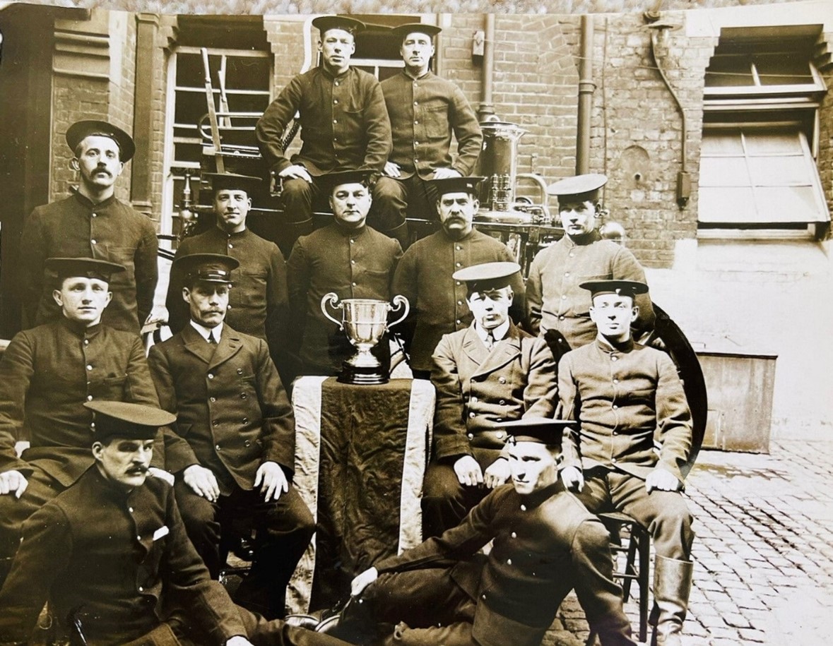Gomm Road, Rotherhithe Fire Station, the crew with the London Fire Brigade Challenge Cup which they won for the smartest turnout of the year, best time of 16.23 seconds.  X..jpg