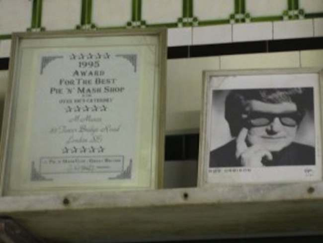 Tower Bridge Road. A portrait of ‘The Big O’ has pride of place behind the counter at Manze’s.   X..png