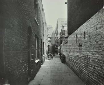 Grange Walk, Bermondsey c1947. Narrow side alley with a view of houses numbers 5-7.  1. X..png