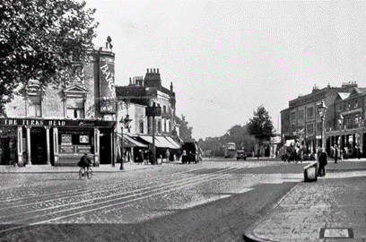 Old Kent Road c1929, Turks Head to the left , just out of view left is the South Metropolitan Gasworks. Kentish Rovers Pub right.  X..png