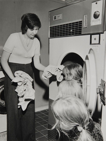 Page's Walk,  Bermondsey c1975. Woman and children in the laundry room in Pages Walk.  X..png