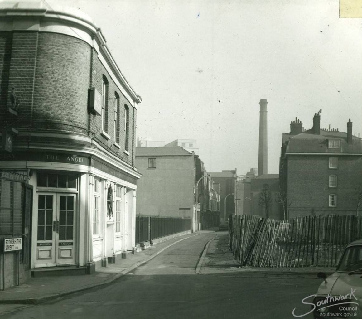 Rotherhithe Street, Angel Pub at the junction with Cathay Street right c1963. The tower of Prince’s Flour Mills is in the background.   X..jpg