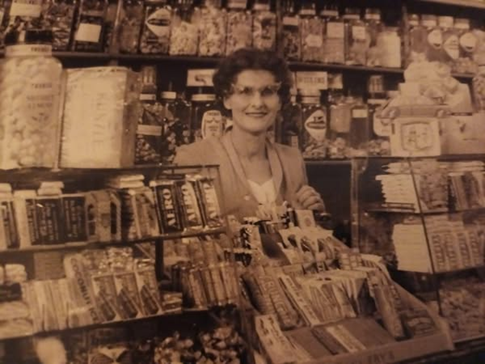 Old Kent Road, Shreeves Sweet Shop, Ivy Sheeves behind the counter..png