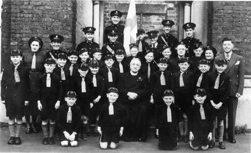 1.Rotherhithe Street, Holy Trinity Church, Canon Thrift, with a mixed group, c1950.  X..png
