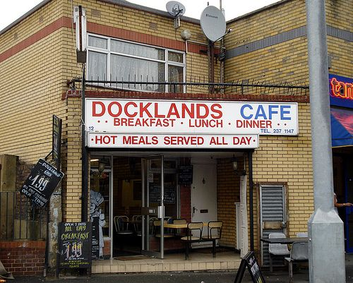 Rotherhithe New Road, Docklands Café, Junction with Bush Road, now a Mexican Food Outlet. Westfield House left.   X..png