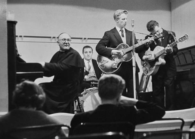 Edmund Street c1959, Anglican priest Geoffrey Beaumont (1903 - 1970) in the club room of the Rose Tavern.  X.png