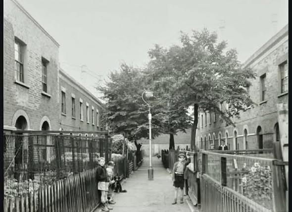 Vaughan Place,  left 9-15, right 1-6, far end behind a high brick wall are the iron frames of two gas storage tanks in the South Metropolitan Gas Works.    X..png