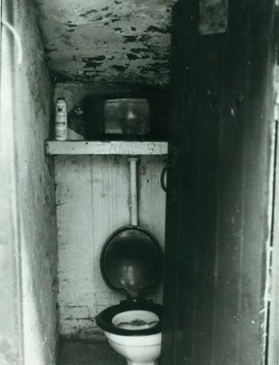 Rolls Road. This is what the toilet looked like in Rolls Road, shared between two families, 1950s  X..png