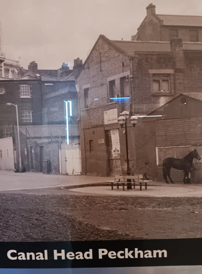 Grand Surrey Canal, end of the Canal, building on the left in the distance is the Jones & Higgins Store, Peckham High Street..png