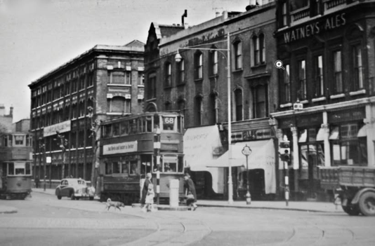 Tower Bridge Road, Bricklayers Arms Pub right. Left of pub is the Barbers where I had my hair cut. X.png