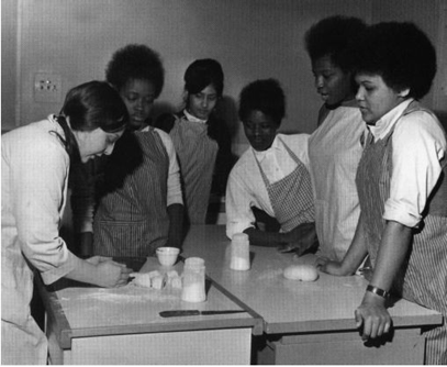 Southwark Park Road, Aylwin School. Girls being taught bread making, c1971..png