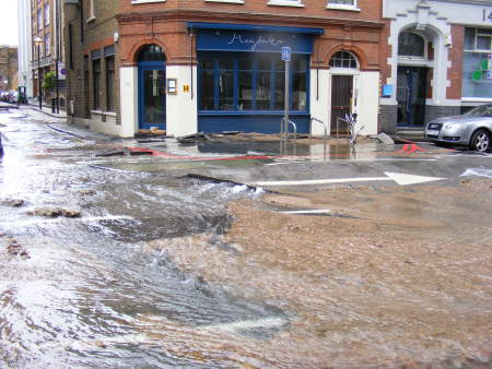 Sandbags had been placed in front of the doors of Magdalen restaurant in Tooley Street as water flowed down Shand Street..jpg