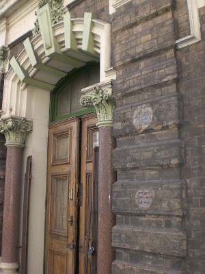 Menier Chocolate Factory not only has a very attractive front door, but also two ghost door numbers who seem to have survived by being hidden under a brass plate or something similar.jpg