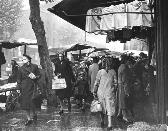 Tower Bridge Road street market, Bermondsey. 1949 Shoppers in the rain.  X.jpg