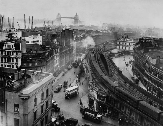 Tooley Street and a view towards Tower Bridge, London Bridge Train Station near Borough and Bermondsey with Hay's Wharf in the 1930's.jpg
