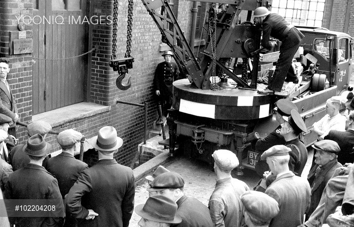 Spa Road. Bermondsey, London Region fire brigade breakdown lorry being deployed to lift a horse from the basement access area into which it fell.  X.jpg