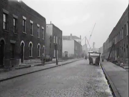 Bevington Street, the Milkman making deliveries with the roof line of Fountain House prominent in the centre distance. 1956.jpg