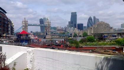 Film A Fish Called Wanda,1988, same location 2016, Looking towards Tower Bridge and St. Katherine Docks from New Concordia Wharf above Bermondsey Wall West..jpg