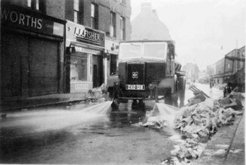 East Street Market – 1964 Washing down after the market has closed..jpg
