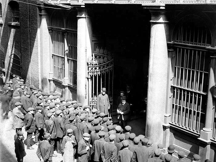 Tooley Street, men queue up to be taken on each day to work c1910..jpg