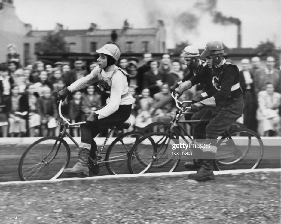 Larnaca Street cycle speedway race between the Bermondsey Greyhounds and the Ruskin Flyers on 4 August 1950, D.Ruskin of the Ruskin Flyers leads..jpg