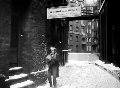 Film Scrooge 1951. Cathedral Street SE1 with St. Mary Overy's Wharf in the background.On Christmas morning, Bob Cratchit Mervyn Johns goes to find Scrooge after receiving a huge turkey from him.jpg
