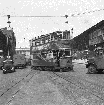 Blackfriars Road c1950, a No. 26 Tram coming out of Southwark Street (right). X.png